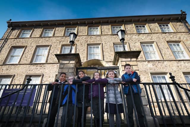 Children from Dallas Road Primary School outside the museum