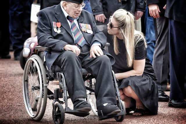 Veteran David Rodwell who was recently awarded the Lgion d'honneur medal chats to his granddaughter Hannah Rodwell-Nicholls before the parade. Armed Forces Day Parade, Morecambe.