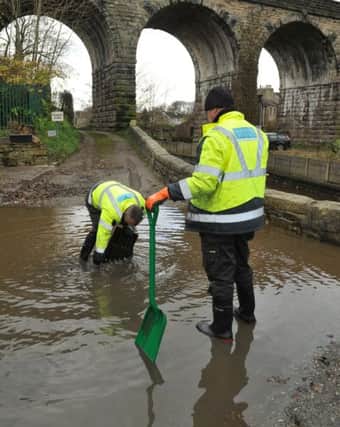 Photo Neil Cross
The floods at Galgate
Workmen clear drains