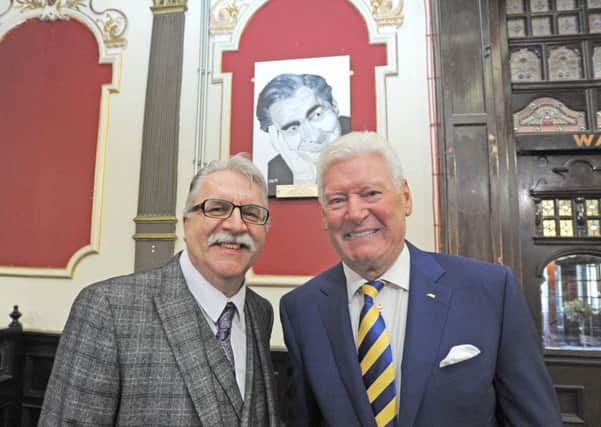 Roy Walker unveils a painting by Dave Miles of Tony Hancock at the Winter Gardens