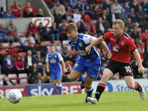 Ryan Winder and Adam Campbell battle for the ball during last year's game at the Globe Arena