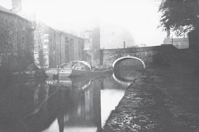 The barge Pet unloading coal next to Penny St. Bridge, Lancaster, before the bridge was rebuilt in 1899-1900. taken from Two Hundred Years of the Lancaster Canal: an Illustrated History by Gordon Biddle