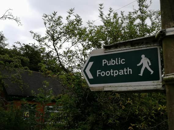 Councillor claims not all public footpaths are signposted due to delayed repairs.