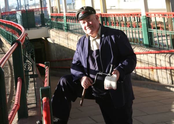 Jim Walker under the clock at Carnforth Station.