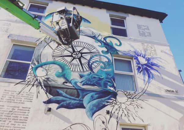 'The Sands and Seas' painting is being created on the side of the old Victoria public house on Victoria Street, Morecambe.