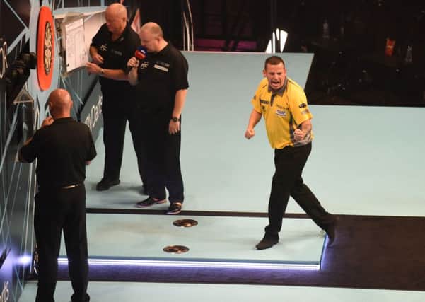 Dave Chisnall in action against Jeffrey de Zwaan in the Bet Victor World Matchplay 2018 at the Winter Gardens, Blackpool. Picture: Chistopher Dean.