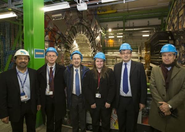 Sir Tejinder Virdee (Imperial College), Roger Jones (Lancaster University), Mark E Smith (Vice-Chancellor of Lancaster University), Graeme Burt (Lancaster University and Cockcroft Institute), Peter Ratoff (Lancaster University and Director of the Cockcroft Institute), Oliver Bruning (Deputy Head of CERN Beams Department) next to the CMS detector (a particle detector) at CERN. Copyright: 2014-2018 CERN