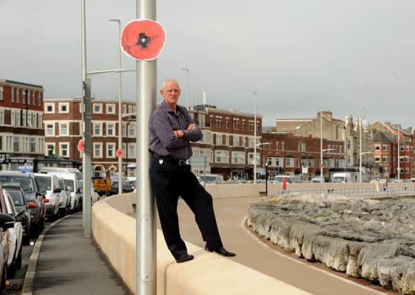 Photo Neil Cross
Steve Trainor of Poppy Scatter Morecambe may have to remove the giant poppies following a row over copyright