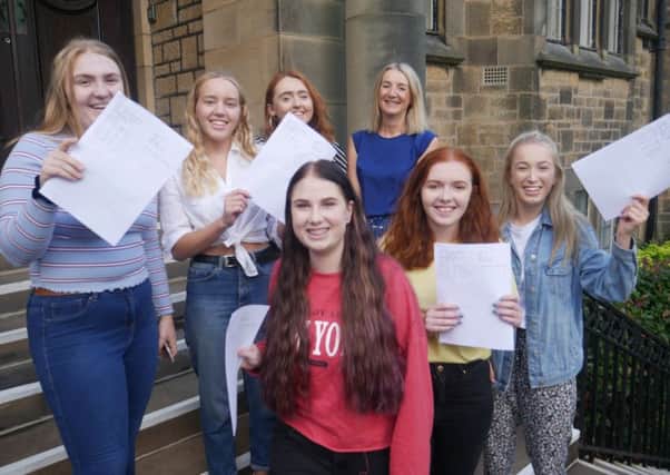 LGGS students celebrate their A-levels. Back row from left to right: Daisy Southern, Emma Gittins, Jen White, Jackie Cahalin (headteacher). Front row from left to right: Abi Thornley, Jody Tidesworth and Megan Dillon.