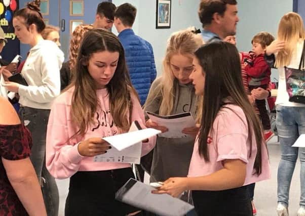 Pupils celebrate their GCSE results in August 2018.