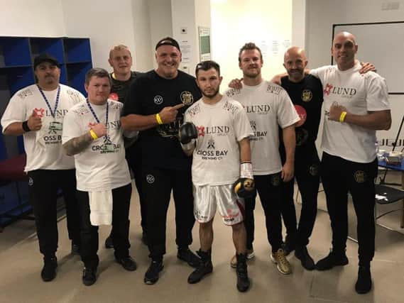 Isaac Lowe celebrates victory in Belfast with his new team including Ricky Hatton, John Fury and Ben Davison.