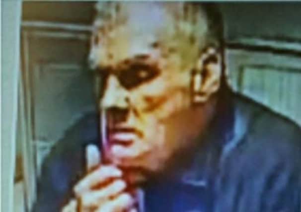 Police want to speak to this man in connection with a theft from a Morecambe hotel.