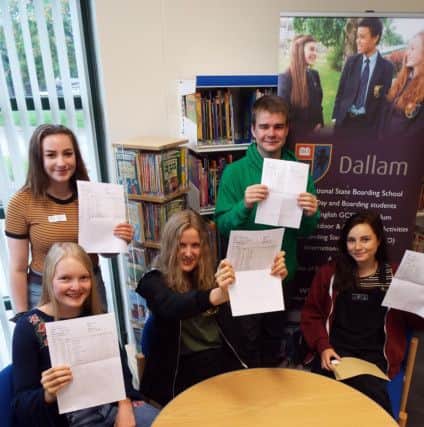 Dallam pupils Flora Knight, Louise Dewhurst and Eva Wood, with (standing) Ruth MacEwan and Daniel Slater celebrate their GCSE results.