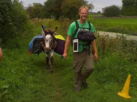 Adam Lee and his donkey Martin. Photo: Ian Trainer