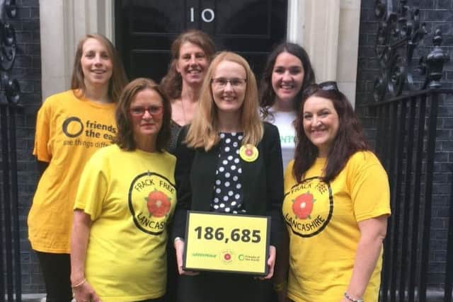 Lancaster MP Cat Smith helps ant-fracking protesters hadn in a petititon at Number 10 Downing Street