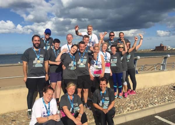 Some of Team Unique Kidz celebrating after completing the Great North Run 2018.