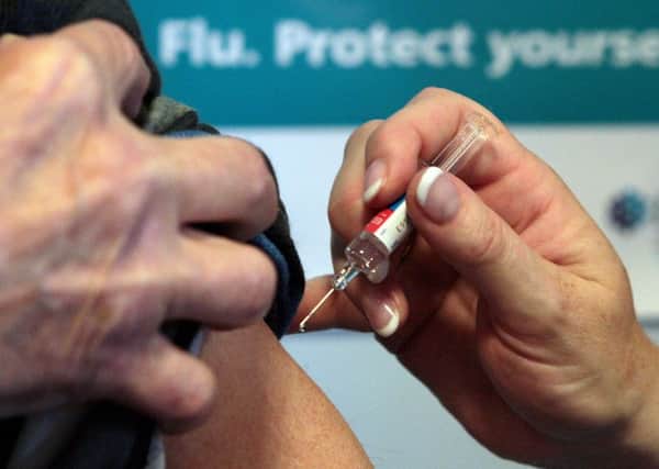 File photo dated 05/10/09 of a patient receiving the seasonal flu vaccine. Latest figures on the number of flu deaths will be published today as the mother of a three-year-old victim urged the Government to further review its vaccination policy. PRESS ASSOCIATION Photo. Issue date: Thursday January 13, 2011. 
Pharmacy giant Boots has also revealed its stores have "very limited" stocks of the winter flu jab and said there was currently no hope of replenishing its supplies. See PA story HEALTH Flu. Photo credit should read: David Cheskin/PA Wire