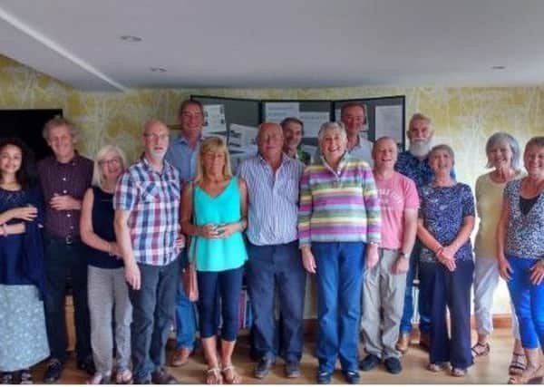 A group of volunteers from Wennington celebrated six months of achievements.
