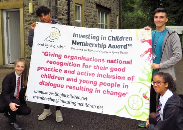 Jamie Crookall, 17, Elena Delaney, 15, Jasmine Lewis, 15 and Alex Lewis, 17 with the Investing in Children Award.