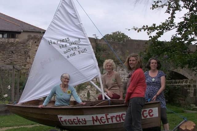 Gina Dowding, standing, with Caroline Jackson, Emily Heath and Mollie Foxall with their boat Fracky McFrackface to protest against fracking in Lancashire