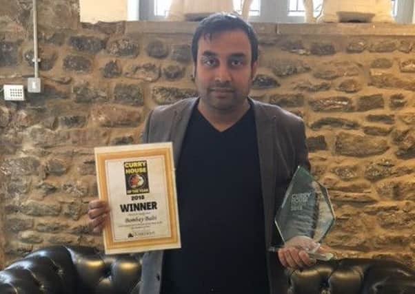 Naz Khan from Bombay Balti with his award for Curry House of the Year run by the Lancaster Guardian.