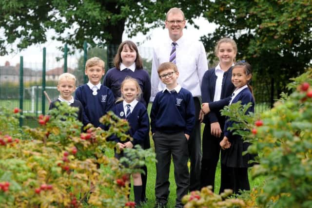 Peter Harrison has become the new headteacher of St Mary's Primary School in Morecambe.  He is pictured with some of the pupils.