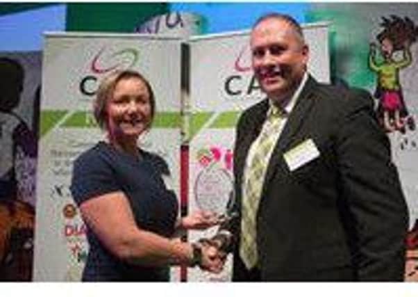 Lisa Richardson, Director of EMUES CIC UK and co-ordinator of Lancaster CAP, received the award from Neil Eccles, a senior manager at Asda and CAP Board Member, at the annual CAP celebration event which this year took place at the Welsh Assembly.