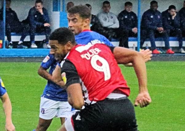 Morecambe's Vadaine Oliver headed against the woodwork