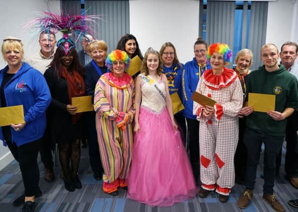 The Morecambe Carnival team along with the recipients of the parade collection. Photo credit: David Forrest.