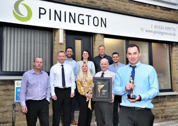 MD Tom Pinington (pictured front right with a recent award) with the team  Pinington Limited, Lancaster, celebrate 70 years in business