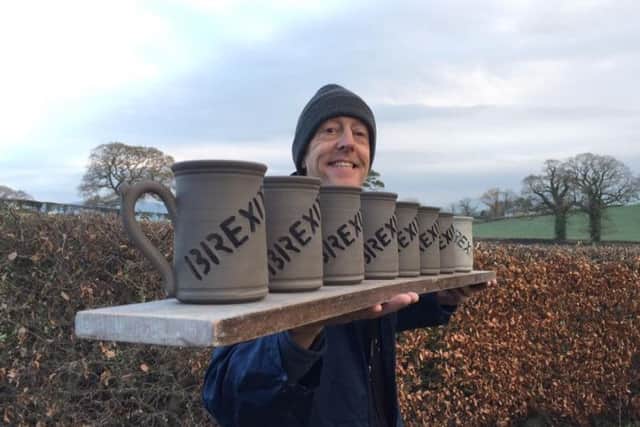 Lee Cartledge with the first eight of the Brexit mugs
