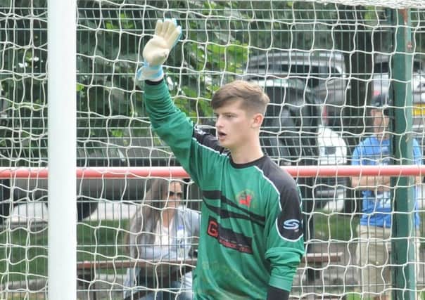 Garstang keeper Will Kitchen was a busy man in their shootout win at Maine Road