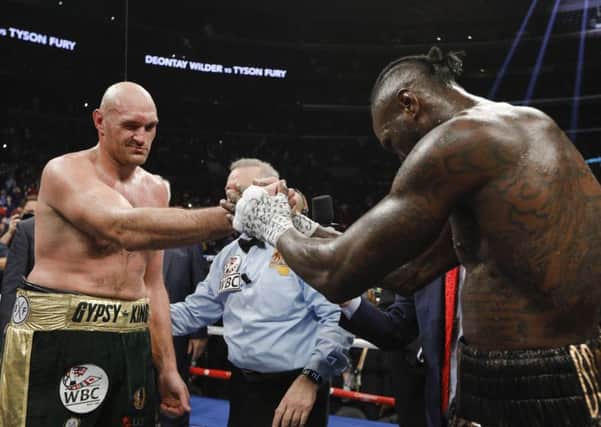 Tyson Fury and Deontay Wilder at the end of their fight. Picture: Esther Lin / Showtime