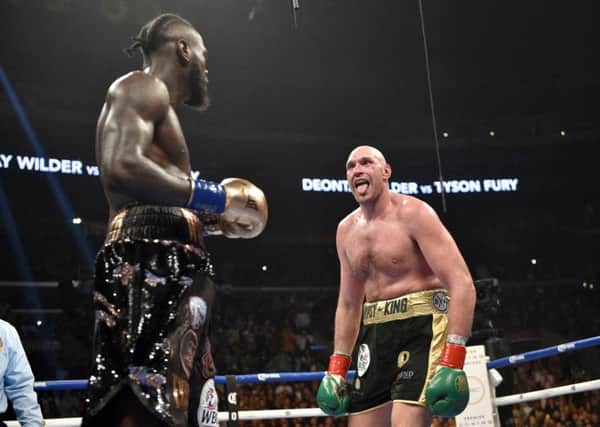 Tyson Fury takes on Deontay Wilder during the WBC Heavyweight Championship bout at the Staples Center in Los Angeles.