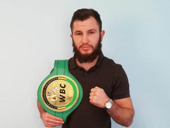 Isaac Lowe with his WBC International featherweight title