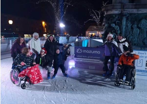 Group of skaters, including charity co-founder Jane Halpin, enjoying the Unique Skating Session at Lancaster on Ice sponsored by Mazuma Mobile.