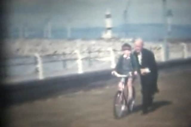 Rennick Hodgson, son of former Midland Hotel owners Morag and Rennick Hodgson learning to ride a bike with the help of Mr Elvin, the head waiter.
