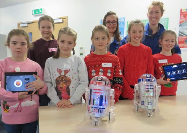 Engineers at Heysham 2 Alex Wilcox and Ally Shankland, with some of the girls who took part in the engineering day at Heysham power station.