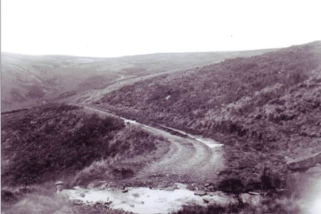 The Cross of Greet Road going from Bentham to Slaidburn around 1920. This road was used by the Taylor family to travel to Slaidburn to shoe horses. A difficult journey in the early days, when using a motorcycle and sidecar. They did not leave Slaidburn until all the horses had been shod. Often this was well after midnight.