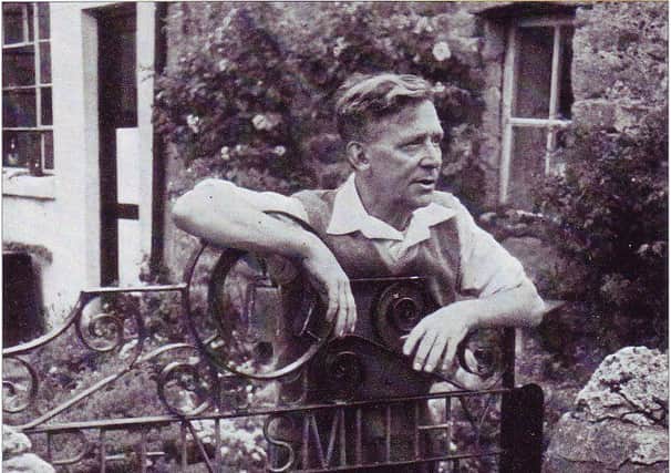 Blacksmith: Mr Robert Taylor the third generation of the Taylor family at his home at Green Smithy in 1957. The design of the gate made by Mr Taylor includes the name of the hamlets, his initials and two symbols of his craft-a horse -shoe and the outline of an anvil.