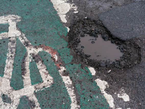 Potholes are a familiar sight