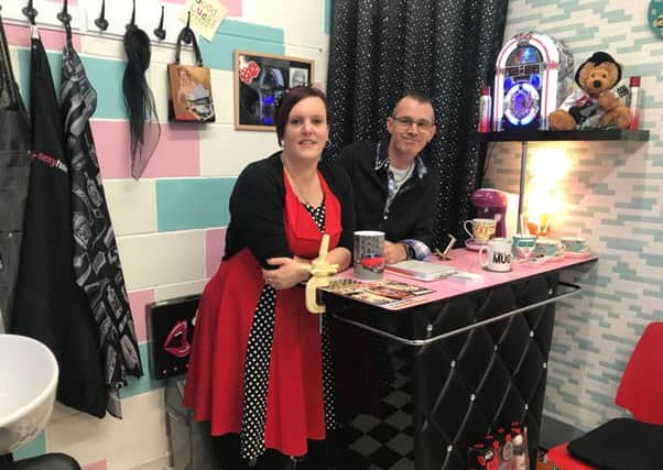Jo and Martin Lane behind the counter of their fifties-themed salon in Festival Market in Morecambe, called Betty's.