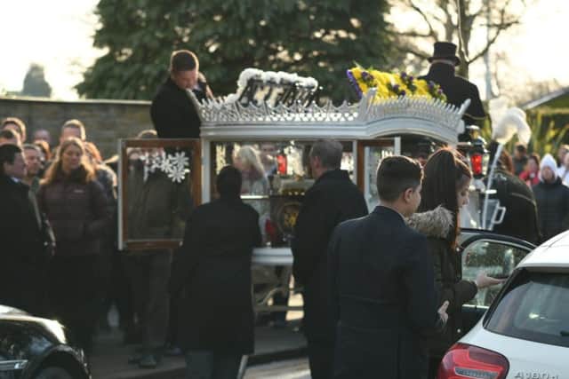 Reece Holt's funeral procession arrives at the crematorium.