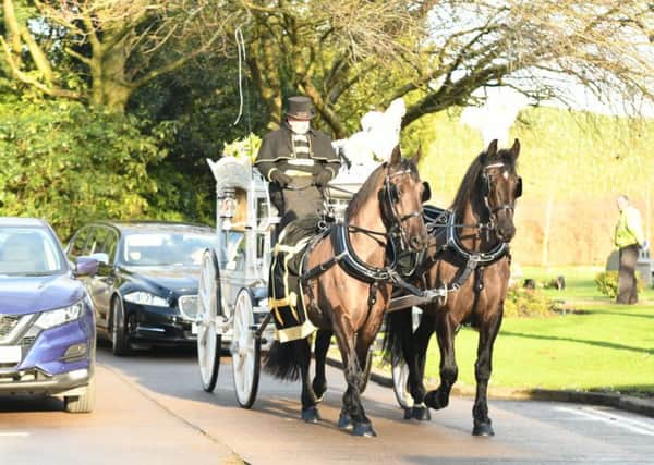 Reece Holt's funeral procession arrives at the crematorium.