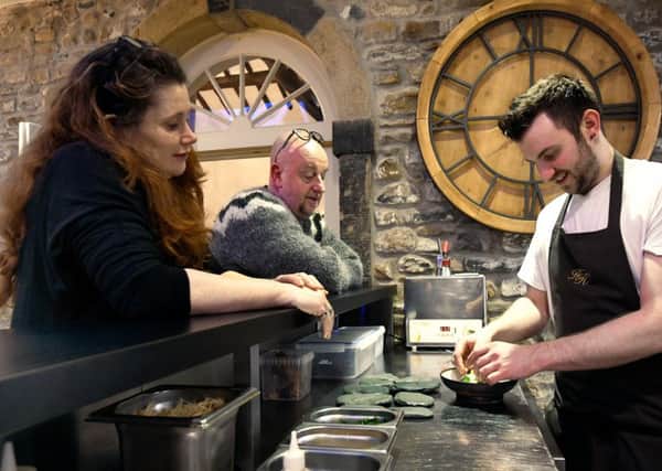 Siobhan and Martin Miles-Moore working on new ideas at Hipping Hall with chef Olli Martin.