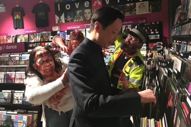 Chee Keong Cheung browsing through the vinyl section in HMV Lancaster
