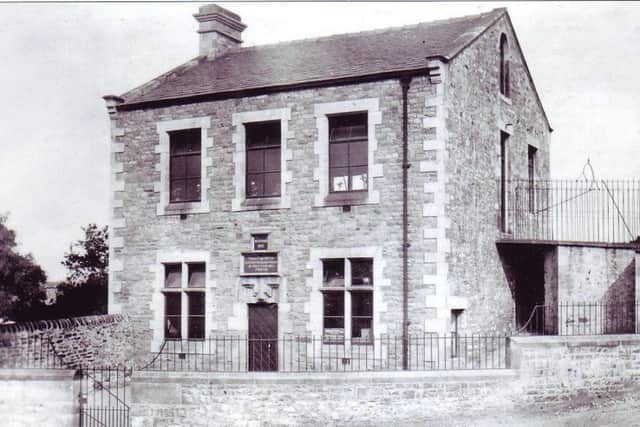 This photograph of the rebuilt school taken around 1910 shows that the lintel with the date 1684 (the year of Captain Pooley's death) has been reused on the new school. The writing over the entrance reads: "This is the gift of Captain Richard Pooley with £200 for ever". In 1897 a corrugated iron roof was constructed to the right of the school to provide shelter for the children in wet weather. The notice in the right hand ground floor window is for the Yorkshire Penny Bank. This was open one night a week and was run by a responsible villager. The children were issued with locked metal money boxes that could only be opened by the bank. These Yorkshire Penny Bank money boxes can occasionally be found in local antique shops.