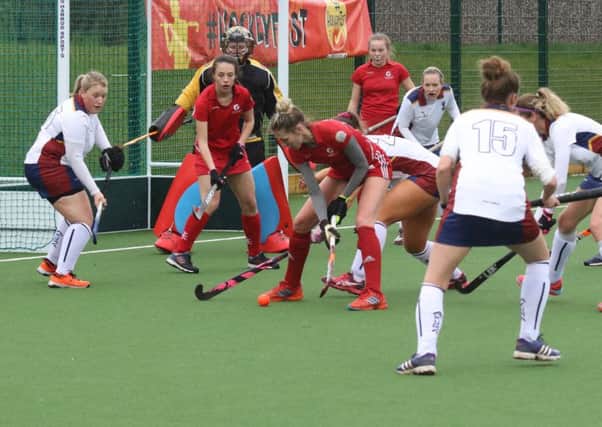 Josie Rice, supported by Summer Muirhead and Grace McGarvey, tries to find a way through the massed ranks of Liverpool Sefton defenders