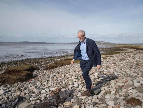 Labour leader Jeremy Corbyn walking on the beach after canvassing in Morecambe while on the local elections campaign. Pic: Jason Roberts/PA Wire