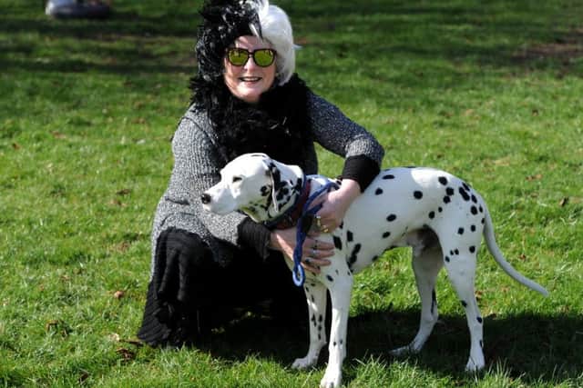 Cancer Care's Bark in the Park event took place for the first time in Happy Mount Park in Morecambe. The event featured dog shows, agility course plus fancy dress, stalls and treasure hunt and attracted a bumper crowd of dog lovers. Beyond Radio presenter Denise Cooper as Cruella de Vil with her Dalmatian, Bandit. Picture by Paul Heyes, Sunday March 24, 2019.